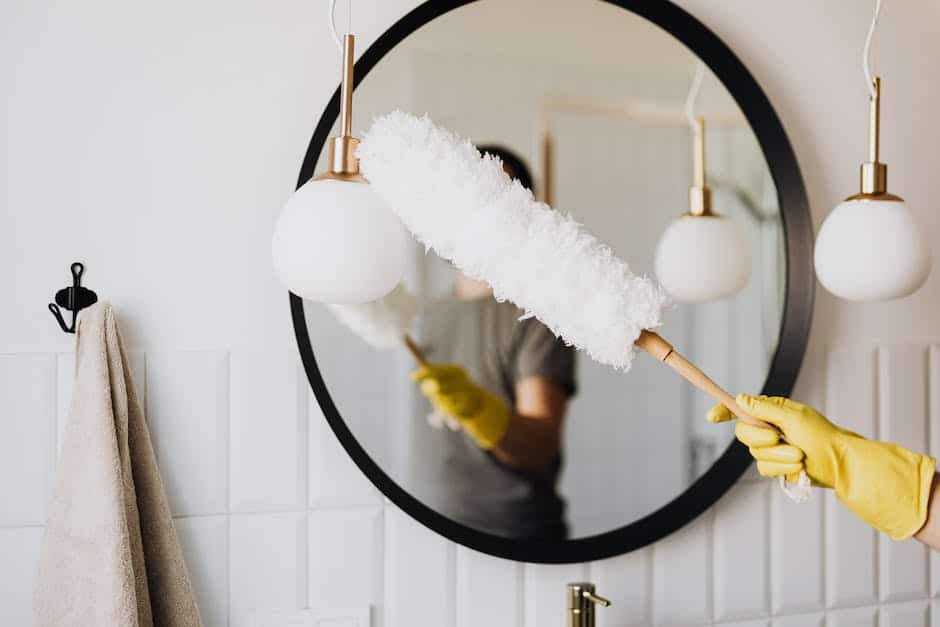 Image of a person cleaning and organizing a home, highlighting the differences between house cleaners and housekeepers